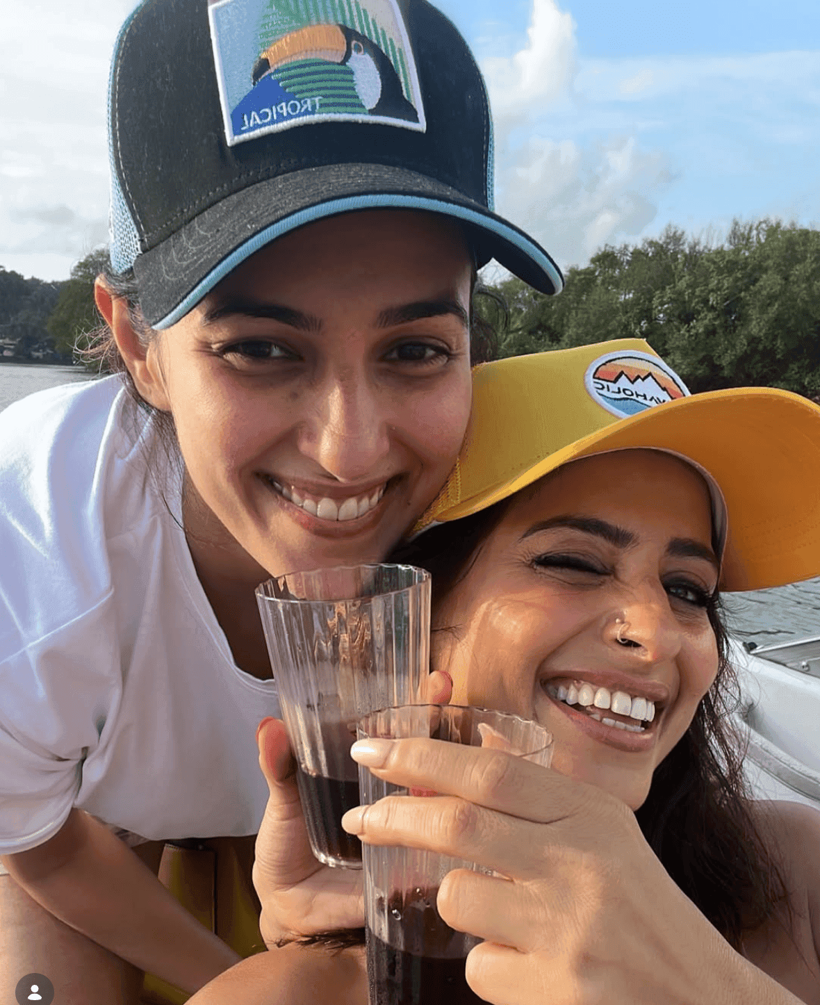 Two caps, one boat, drinks that came out of nowhere — this is what a good afternoon on the water looks like.